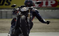 Yamaha-FZ-09-one-hand-wheelie.jpg